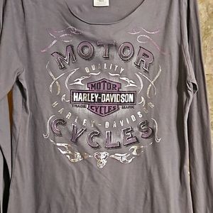 Grey with lavender accents & silver metal tone lettering.